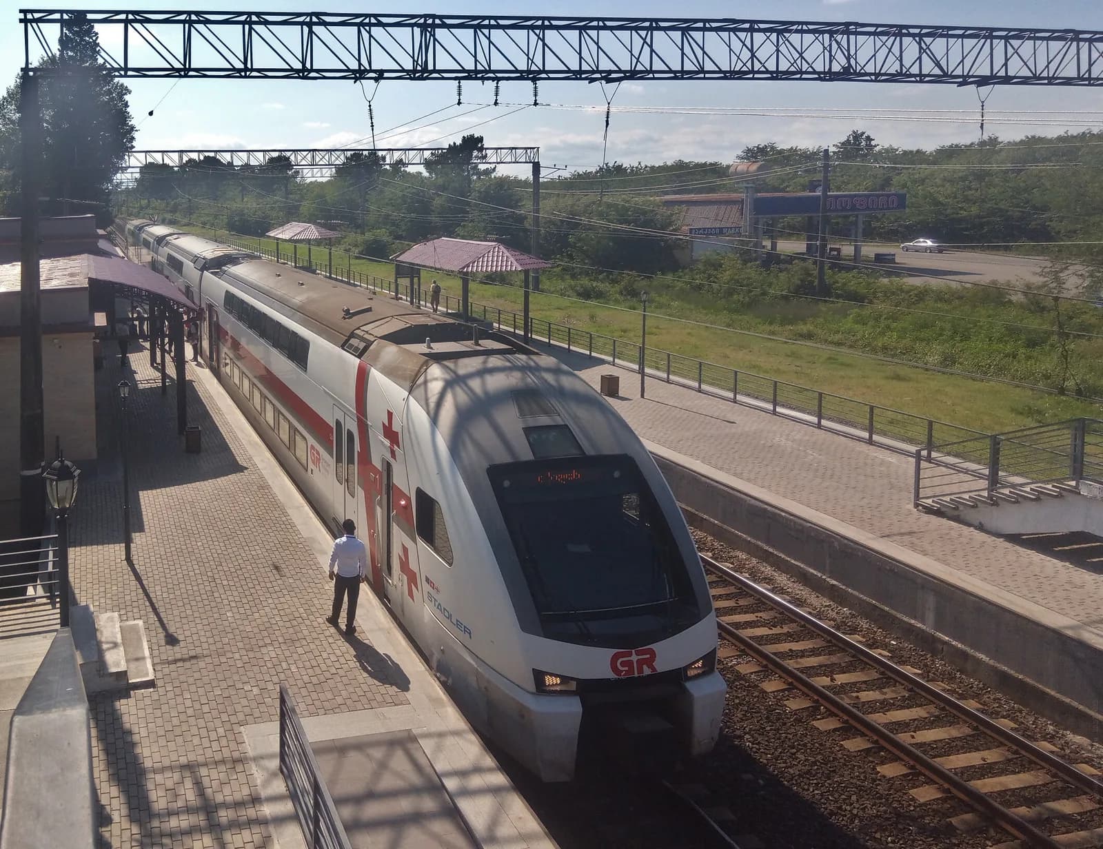 A Georgian Railway Stadler double-deck train waiting at the platform of Kutaisi Airport's own railway station